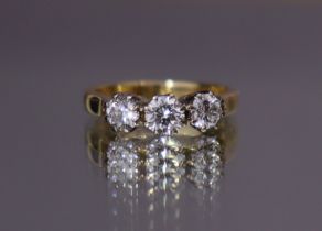 A THREE-STONE DIAMOND RING, the round brilliant-cut stones with combined weight of approx. 1.25