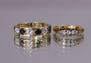 A 9ct. gold ring set three round-cut sapphires with white stones in between, size: T/U; 3.7gm & an