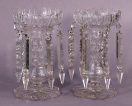 A pair of Victorian cut-glass candle lustres, each circular bowl with shaped rim & hung with prism