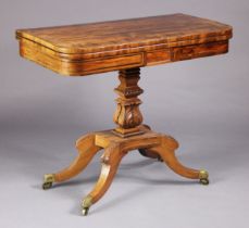 A Regency mahogany card table with rosewood crossbanding to the rectangular fold-over top, inset