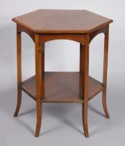A late 19th/early 20th century inlaid mahogany two-tier hexagonal occasional table with arched