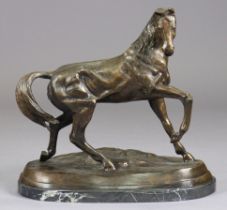 A large bronzed speltre model of a horse in the manner of Mene, with fore-leg raised, standing on