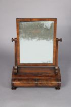 A Georgian mahogany swing dressing mirror with fluted supports, fitted two short drawers to the