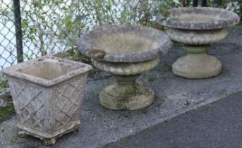 A pair of 20th century stone garden urns of tazza form, cm wide x cm high; & another of square