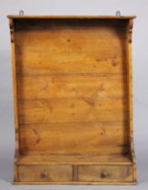 An antique French provincial elm and pine pot-board, fitted with an arrangement of seven hooks above