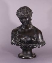 A late 19th/early 20th century painted plaster bust of Clyte, after the antique, on round socle,