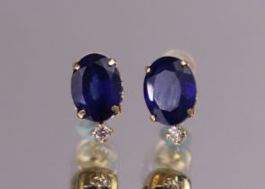 A pair of sapphire ear-studs, the oval-cut stones with a combined weight of approx. 3 carats & a