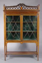 An Edwardian inlaid mahogany display cabinet, fitted two shelves enclosed by a pair of astragal