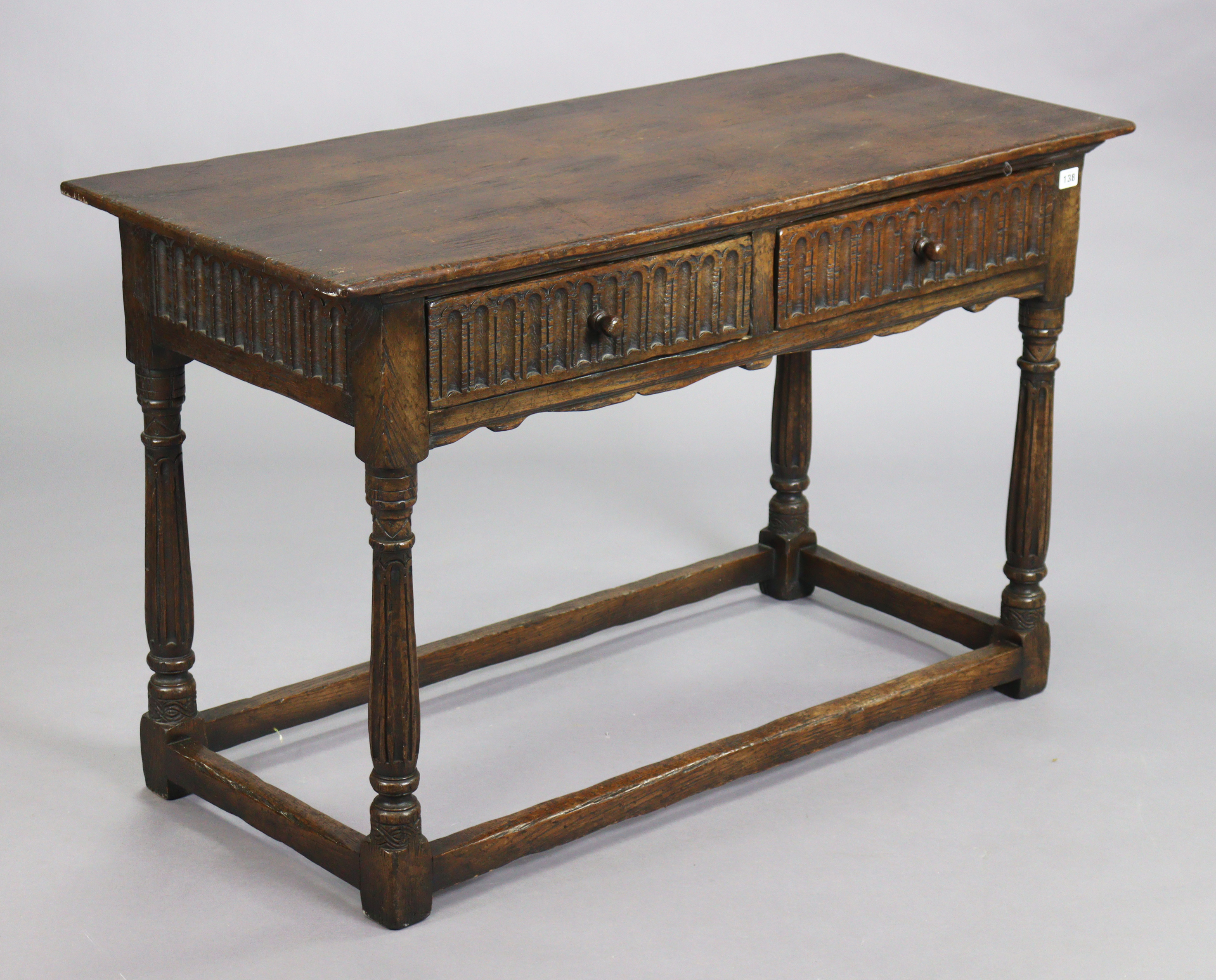 A reproduction oak serving table with a rectangular top, fitted two frieze drawers with moulded - Image 2 of 5