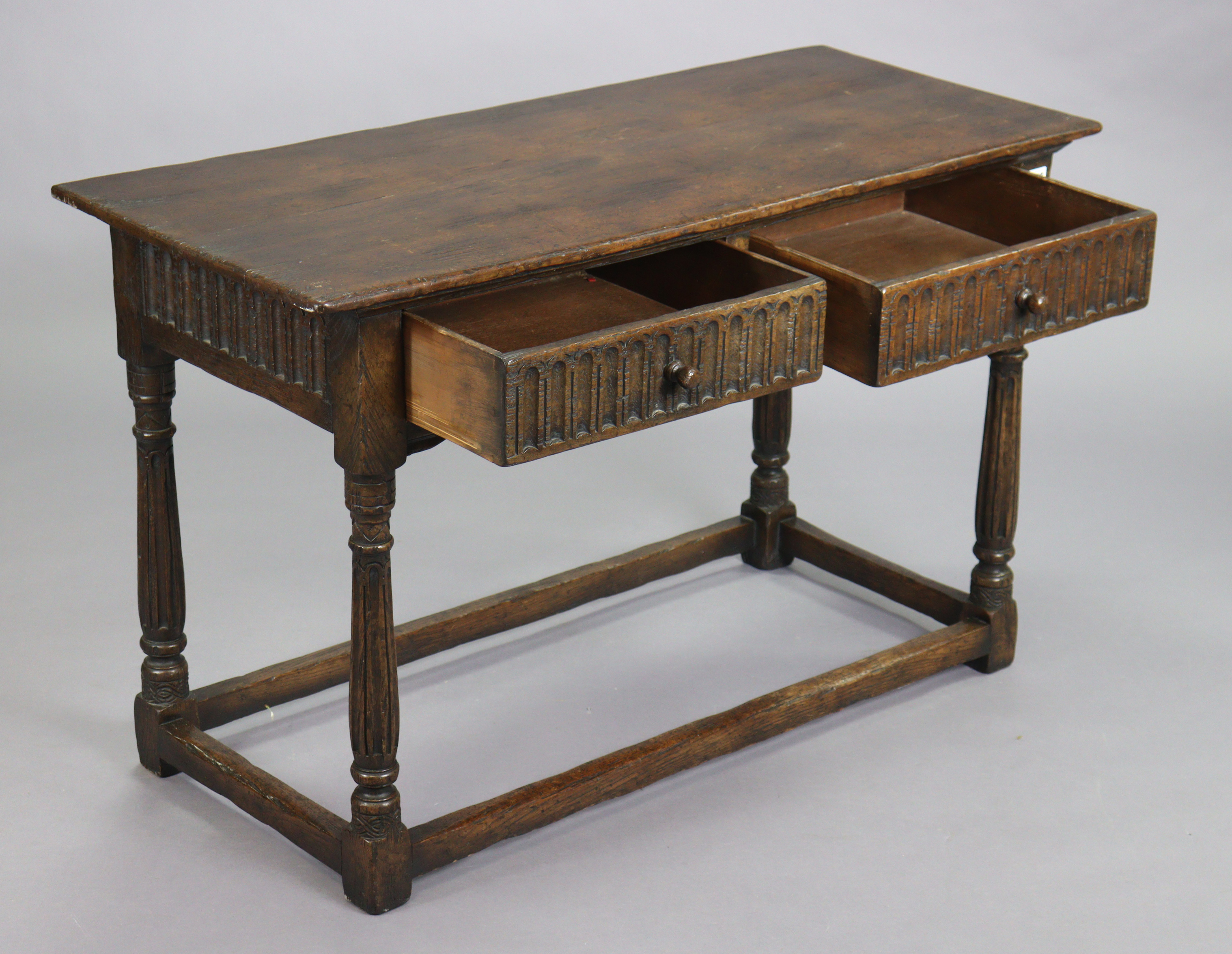 A reproduction oak serving table with a rectangular top, fitted two frieze drawers with moulded - Image 3 of 5