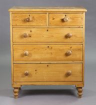 A Victorian pine small chest fitted two short & three long graduated drawers with turned knob