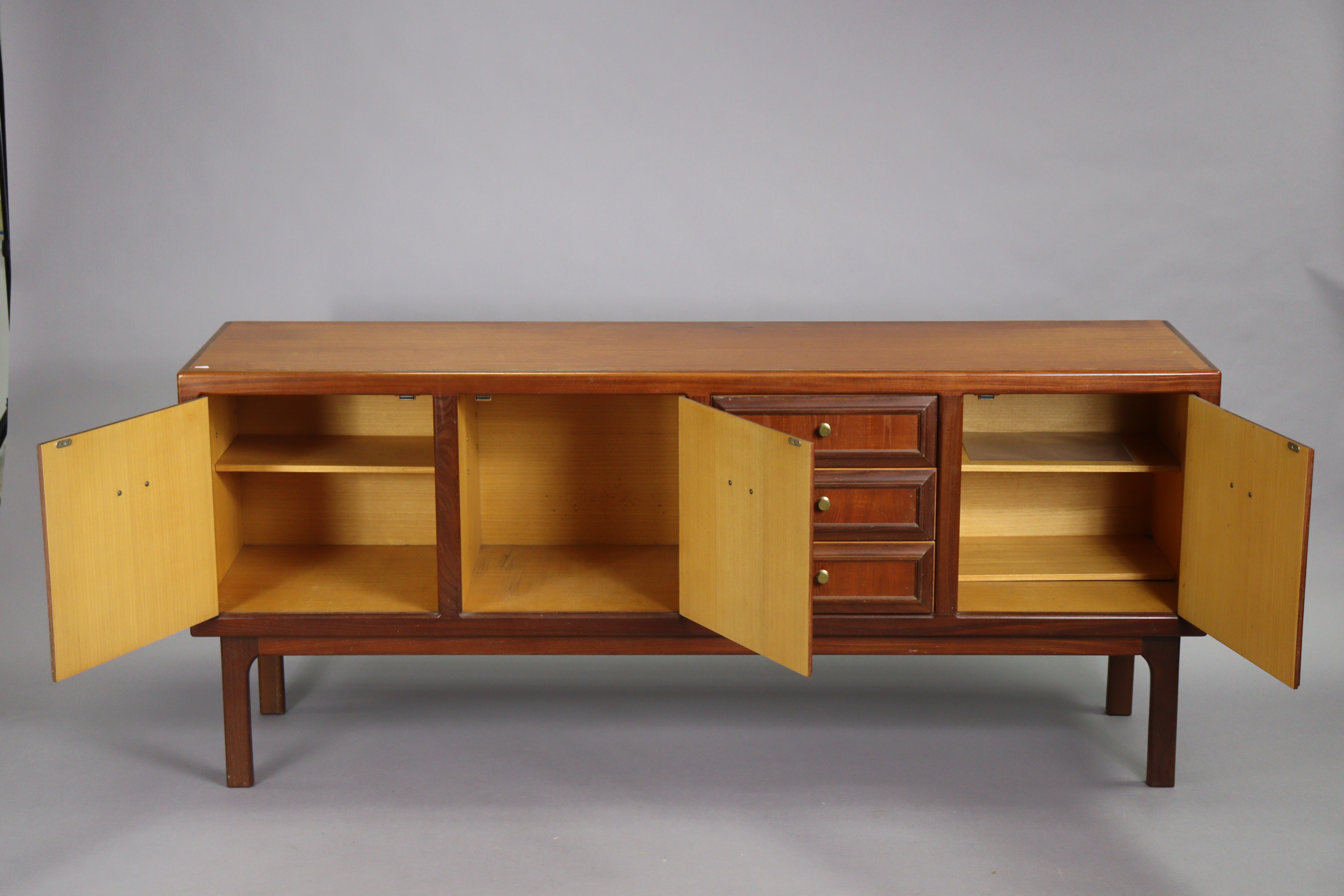 A 1970’s teak circular extending dining table with an additional leaf, & on four square tapered - Image 13 of 17