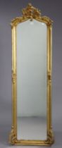 A 19th century-style gilt frame rectangular wall mirror with a pierced scroll surmount, beaded edge,