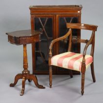 A 19th century mahogany bow-back carver chair with a padded seat, & on ring-turned tapered legs;