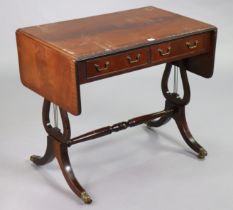 A reproduction mahogany sofa table fitted two frieze drawer, & on lyre-shaped end supports & splay