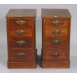 A pair of mahogany bedside chests each fitted four long graduated drawers with cast-iron swing