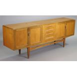 A G-Plan teak sideboard fitted four long drawers to centre flanked by a cupboard to either side