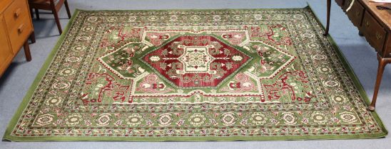 A similar modern Turkish carpet of green & ivory ground & with all-over multi-coloured floral