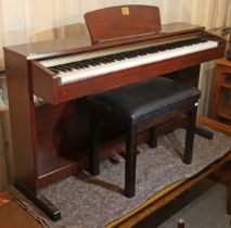 A Yamaha “Clavinova” electric keyboard in a mahogany-finish case, 135cm wide x 61cm high, with