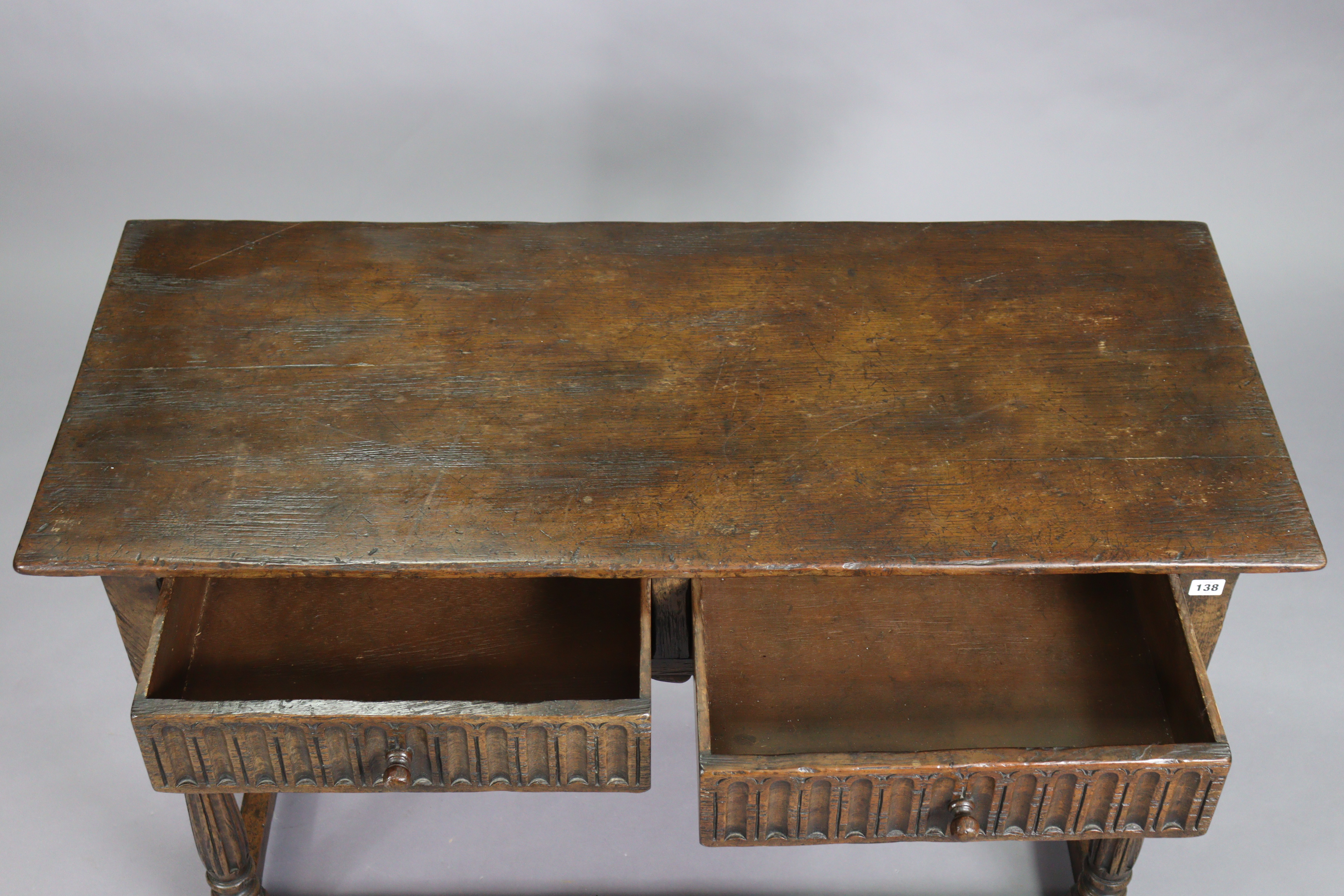 A reproduction oak serving table with a rectangular top, fitted two frieze drawers with moulded - Image 4 of 5