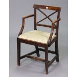 A Late 19th/early 20th century rail-back carver chair with a padded drop-in-seat, & on square