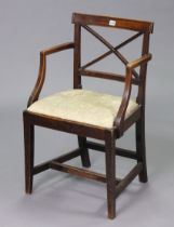 A Late 19th/early 20th century rail-back carver chair with a padded drop-in-seat, & on square
