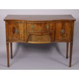 A late 19th century regency-style inlaid-mahogany sideboard, of serpentine shape, fitted two deep