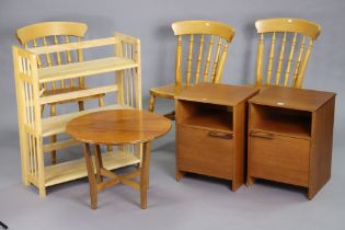 A pair of teak bedside cupboards, 40.5cm wide x 55cm high; a circular occasional table; a fold-