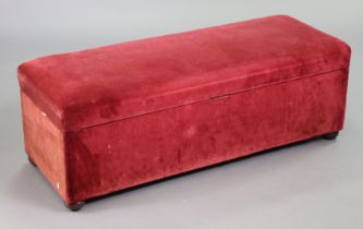 An early 20th century blanket box or box ottoman with a hinged lift-lid upholstered crimson velour,