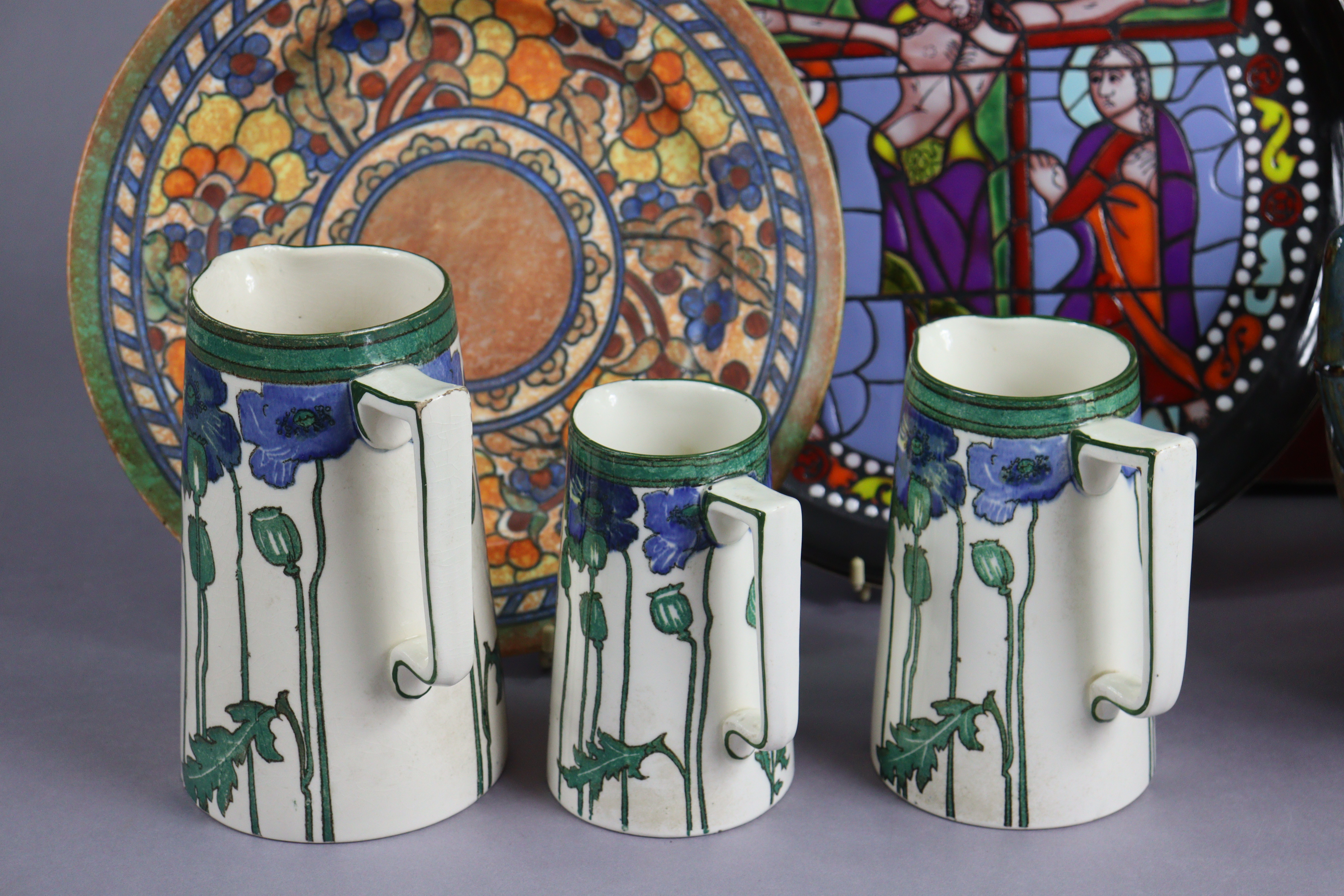 A Charlotte Rhead pottery fruit decorated dish 31cm diameter; a set of three Royal Doulton graduated - Image 3 of 14