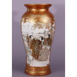 A late 19th century Japanese Kutani porcelain baluster vase with finely painted scenes of ladies &