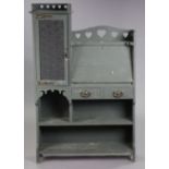 An arts & crafts grey painted wooden writing cabinet fitted with numerous cupboards, drawers &