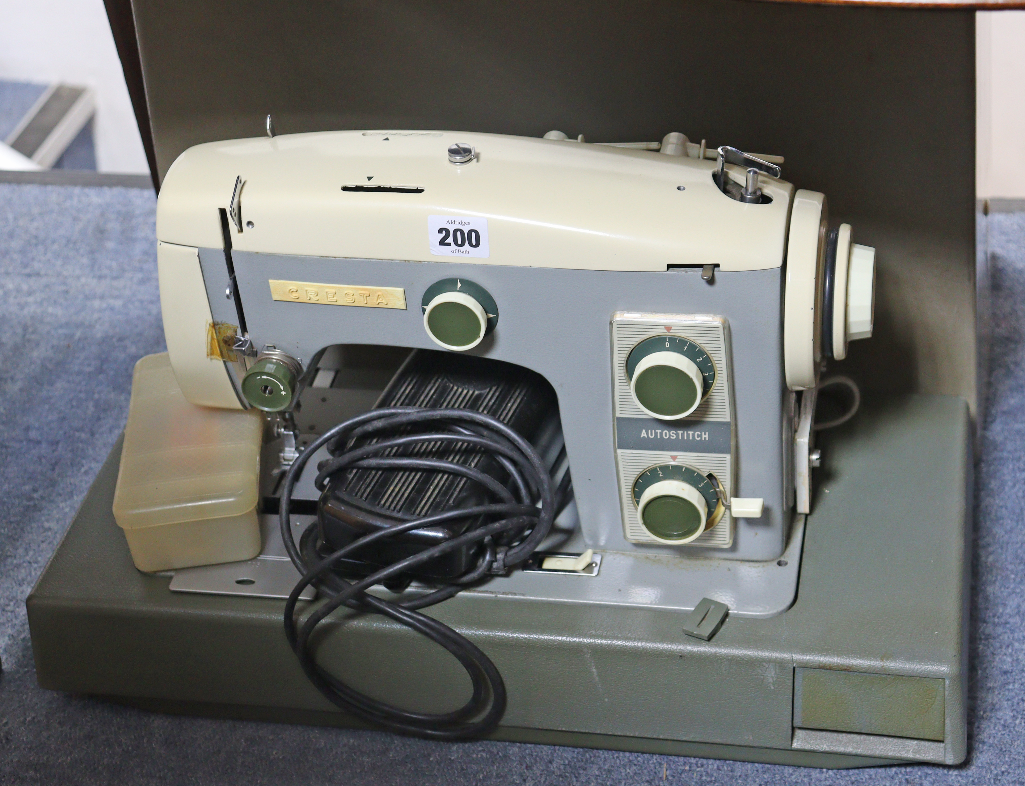 A Cresta “Autostitch” electric sewing machine; & a Singer hand-sewing machine, each with case.