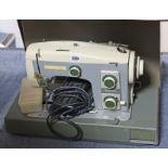 A Cresta “Autostitch” electric sewing machine; & a Singer hand-sewing machine, each with case.