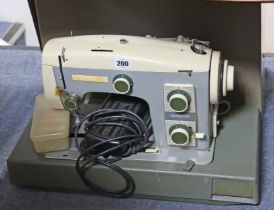 A Cresta “Autostitch” electric sewing machine; & a Singer hand-sewing machine, each with case.