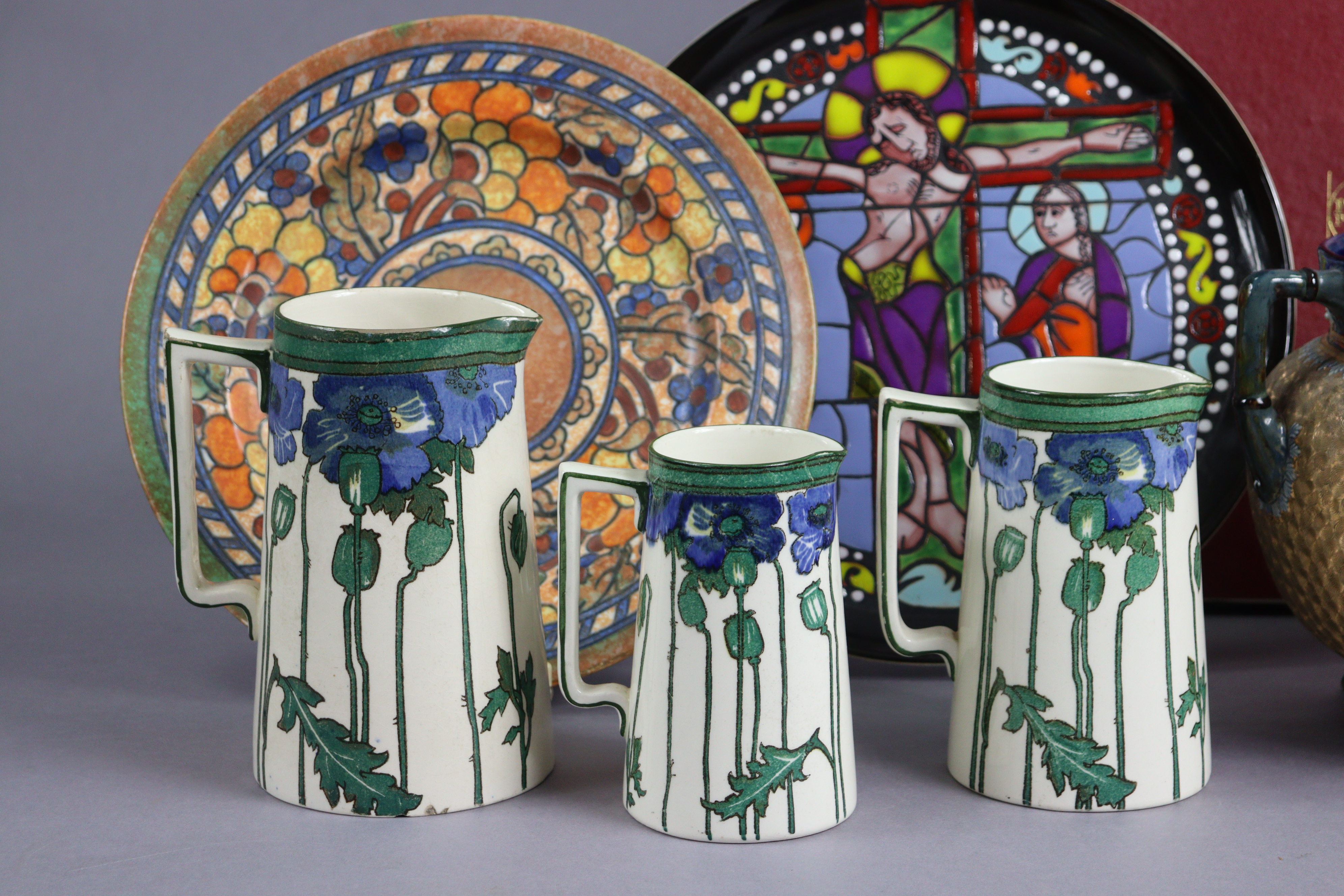 A Charlotte Rhead pottery fruit decorated dish 31cm diameter; a set of three Royal Doulton graduated - Image 2 of 14