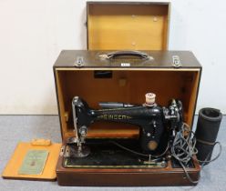 A vintage singer hand sewing machine, with case; together with an Olympia portable typewriter,