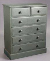 A light green painted pine chest fitted two short & four long drawers with turned knob handles, & on