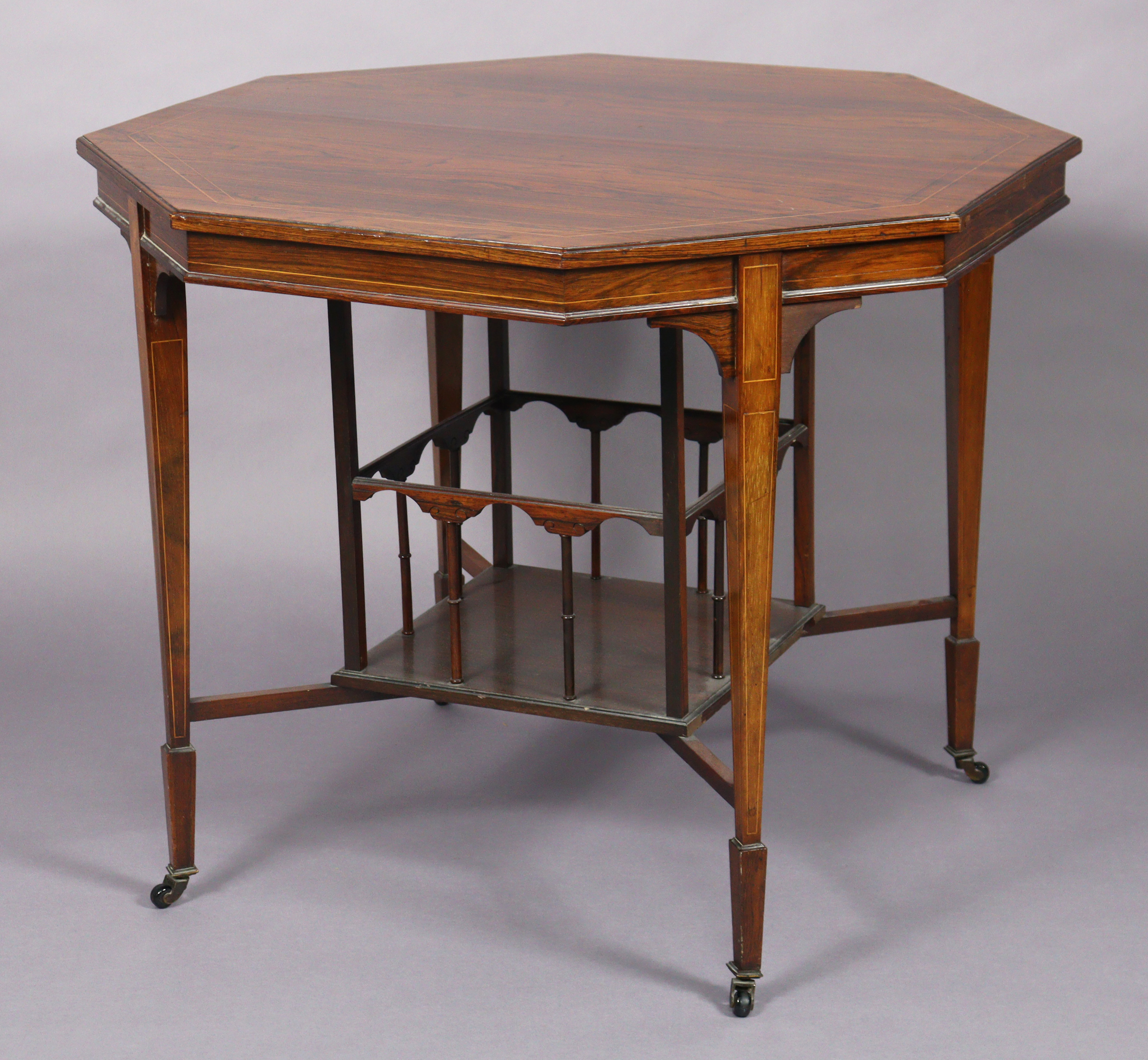 A Victorian rosewood octagonal centre table, the figured top with boxwood inlay & moulded edge,