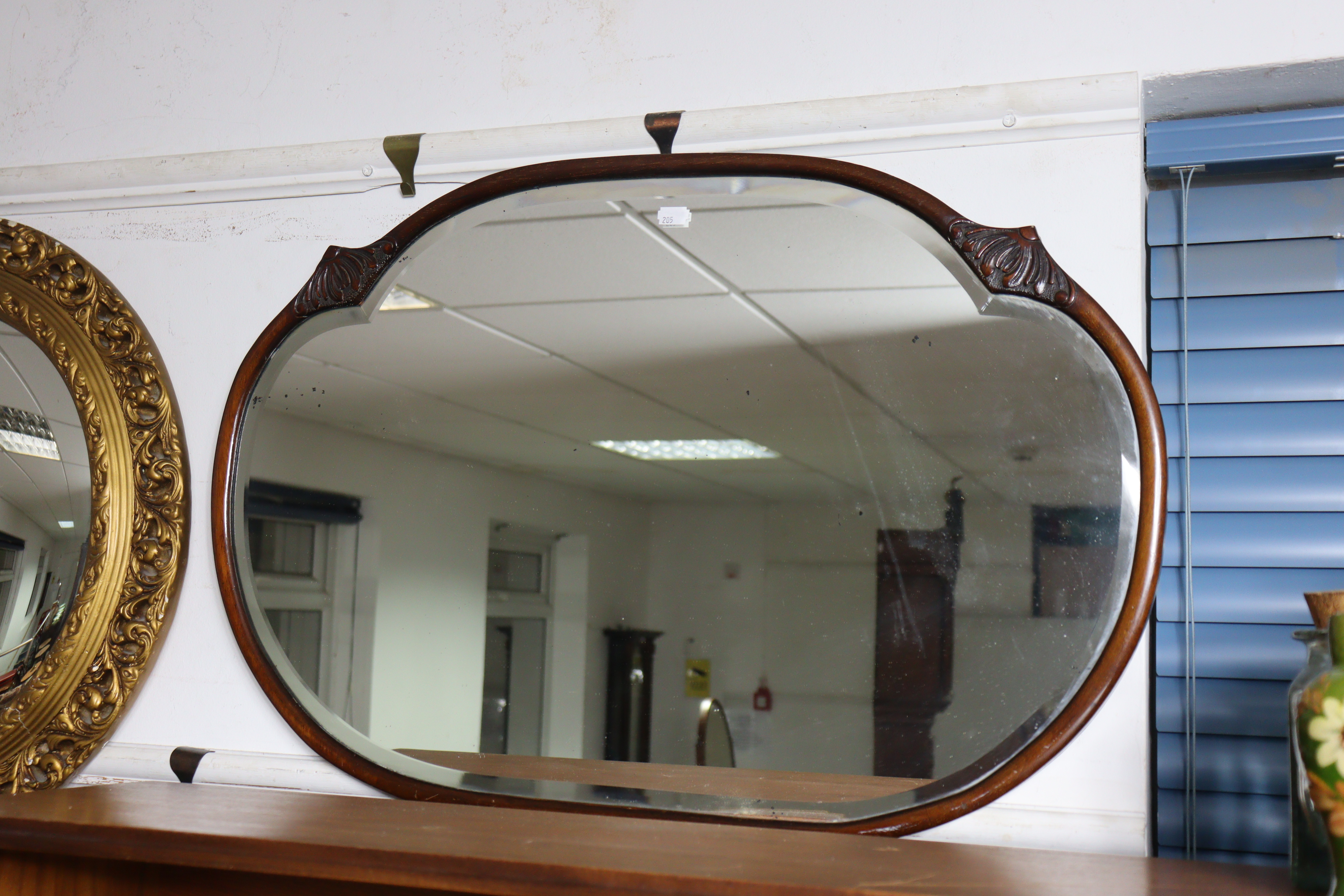 A gilt frame convex wall mirror with a pierced & raised scroll border, 59cm diameter; together - Image 2 of 5