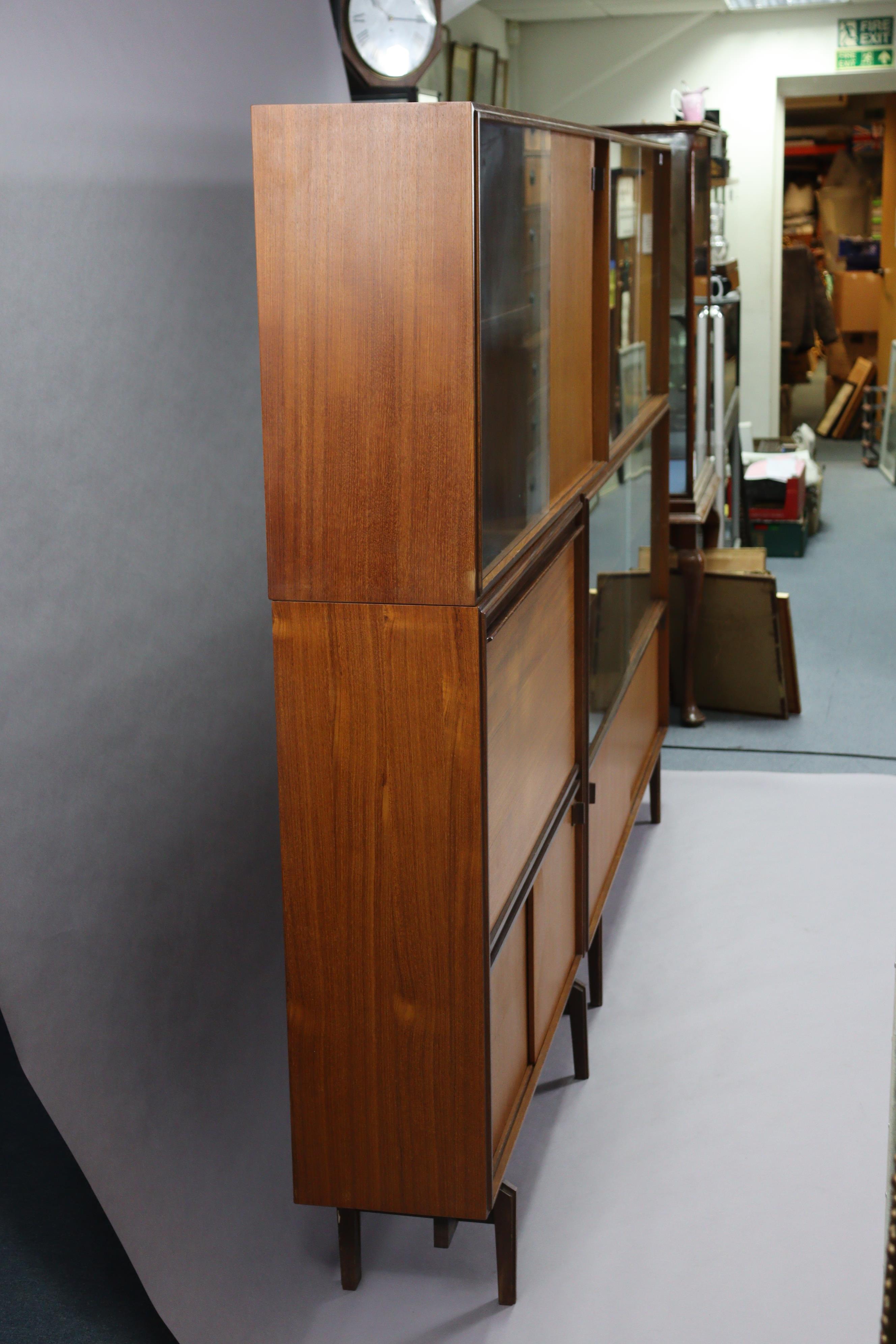 A mid-20th century teak tall wall unit fitted with an arrangement of shelves & cupboards, & on short - Image 3 of 10