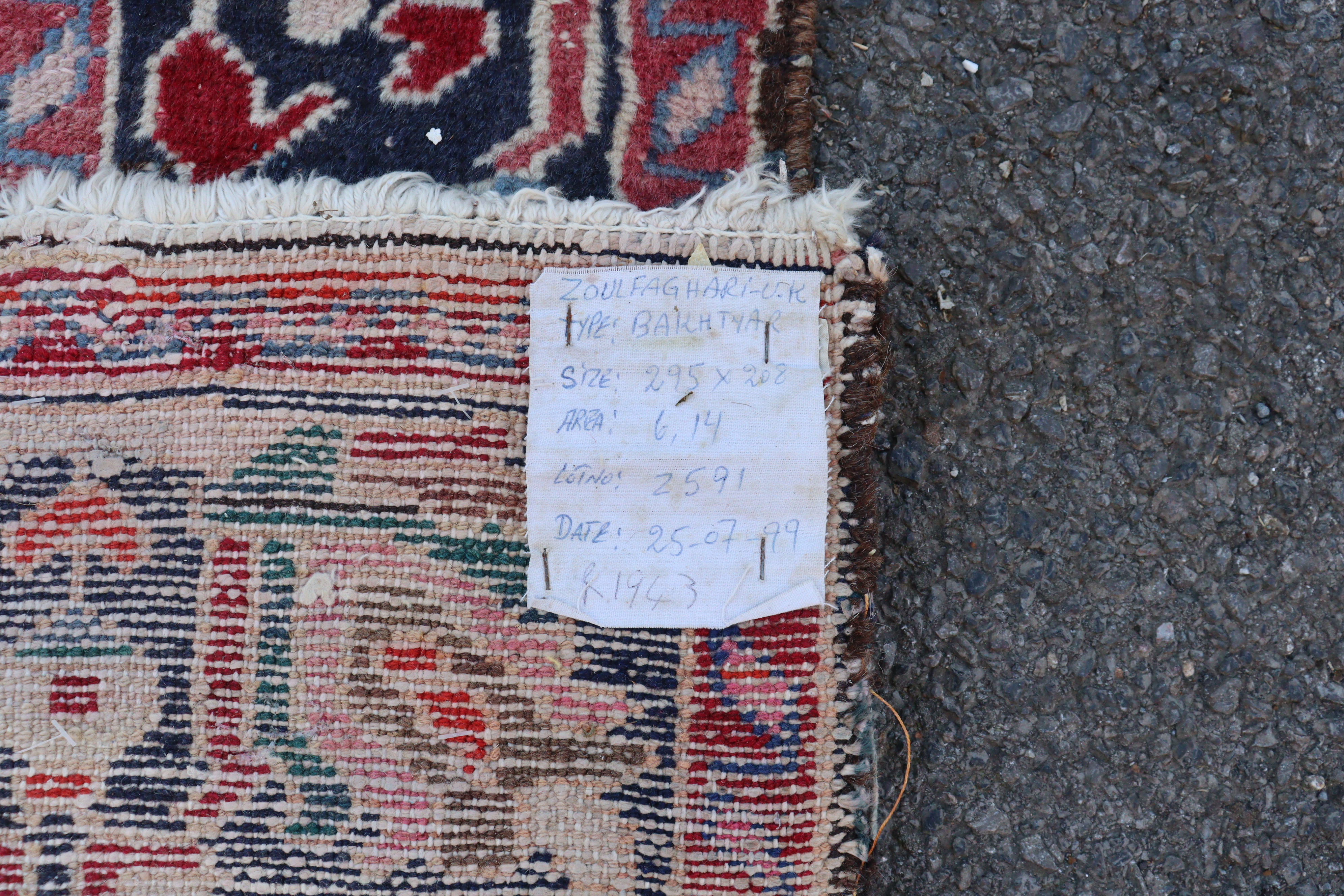 A Bakhtiar carpet of madder ground with central medallion & all-over repeating geometric designs in - Image 2 of 8