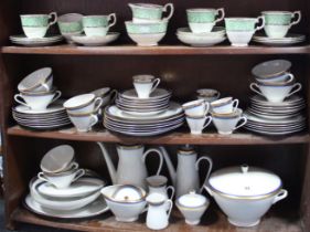 A German porcelain sixty-three piece part dinner, tea & coffee service of white ground & with gold &