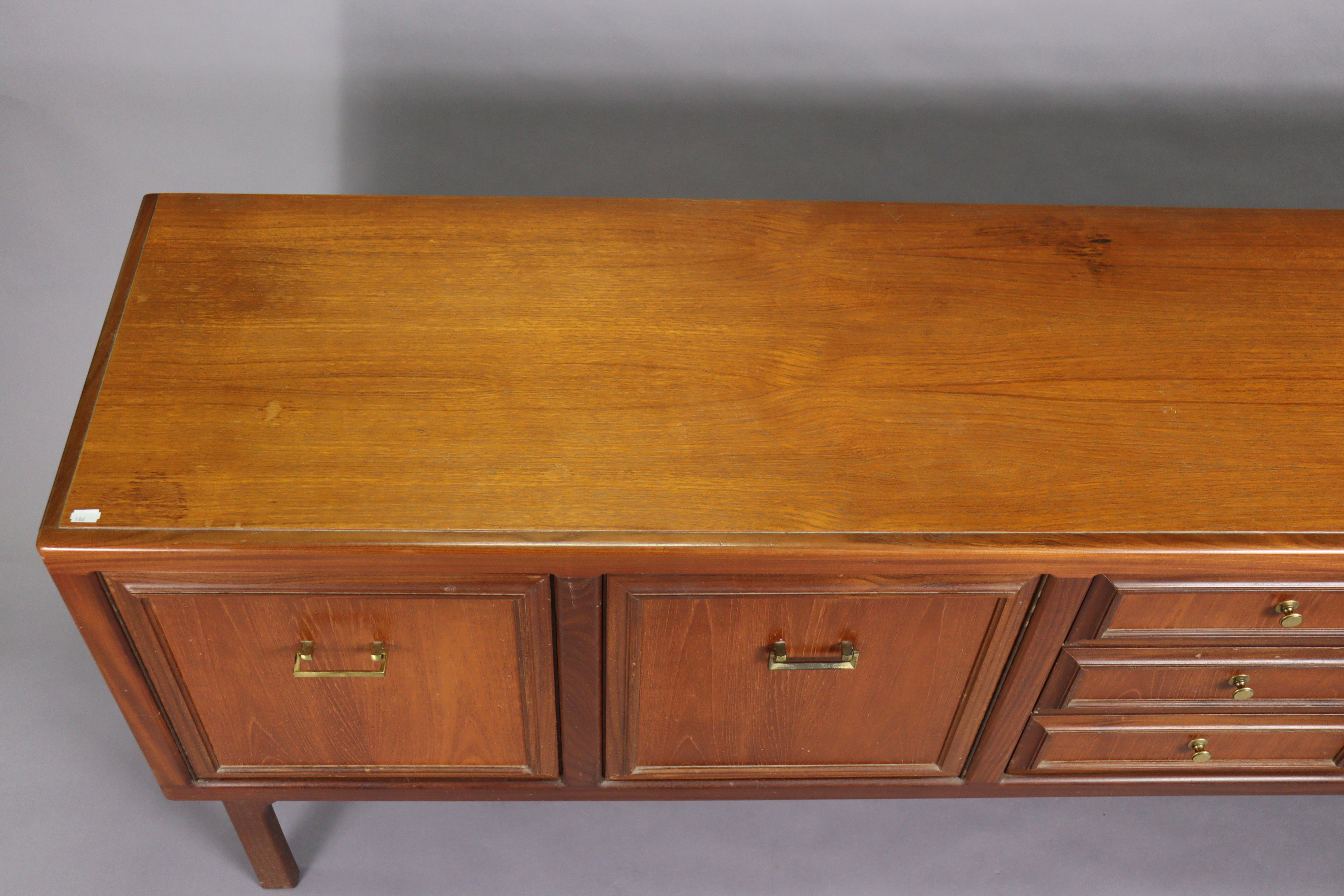 A 1970’s teak circular extending dining table with an additional leaf, & on four square tapered - Image 15 of 17