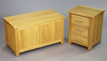 A light oak three-drawer bedside chest, 47cm wide x 60.5cm high; & a similar blanket box, 90cm