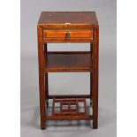 A Chinese hardwood square three-tier occasional table fitted frieze drawer to the upper tier, & on