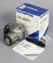 An Olympus “IS-300” camera, boxed.