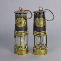 Two vintage Thomas & Williams of Aberdare brass & steel miner’s lamps, 25cm high.