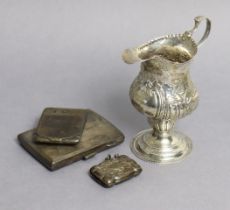 A George III silver cream jug of inverted pear shape, with embossed decoration of a farmyard