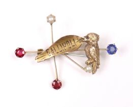 An “Anzac” bar brooch marked “9ct.”, formed as the Southern Cross set split pearls, simulated rubies